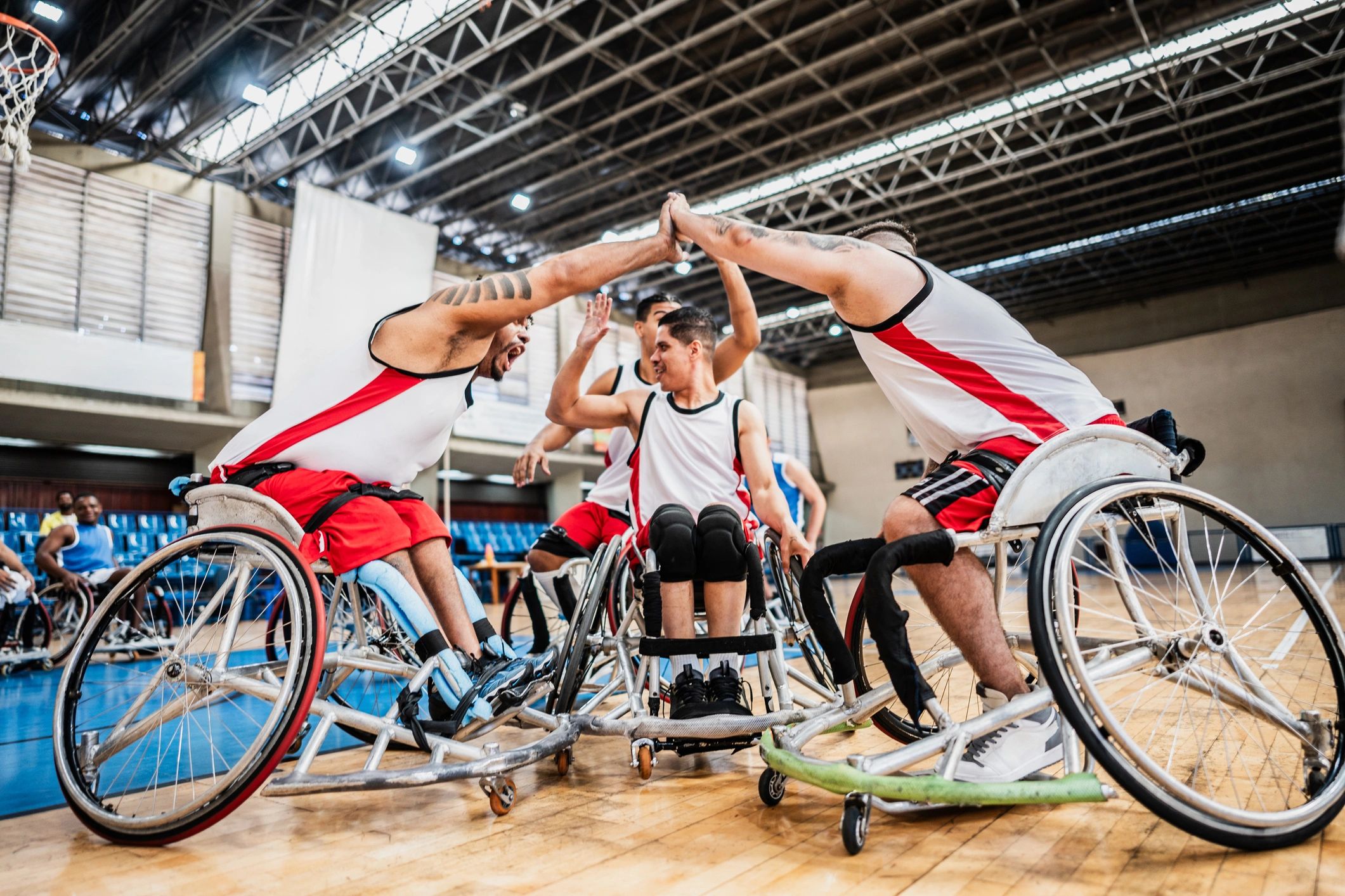 Wheelchair basketball players celebrating during a match