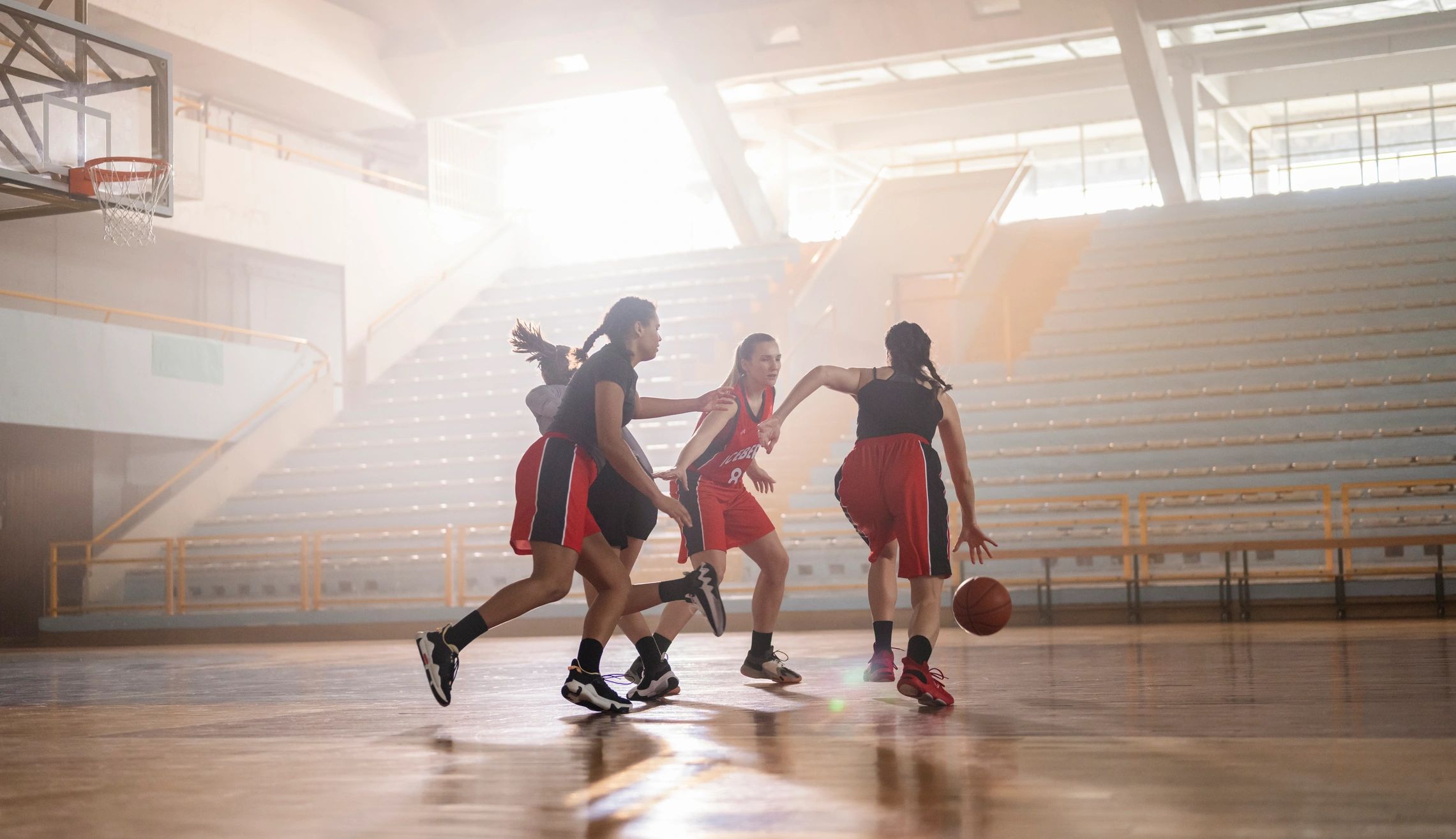 Basketball team in motion during indoor training