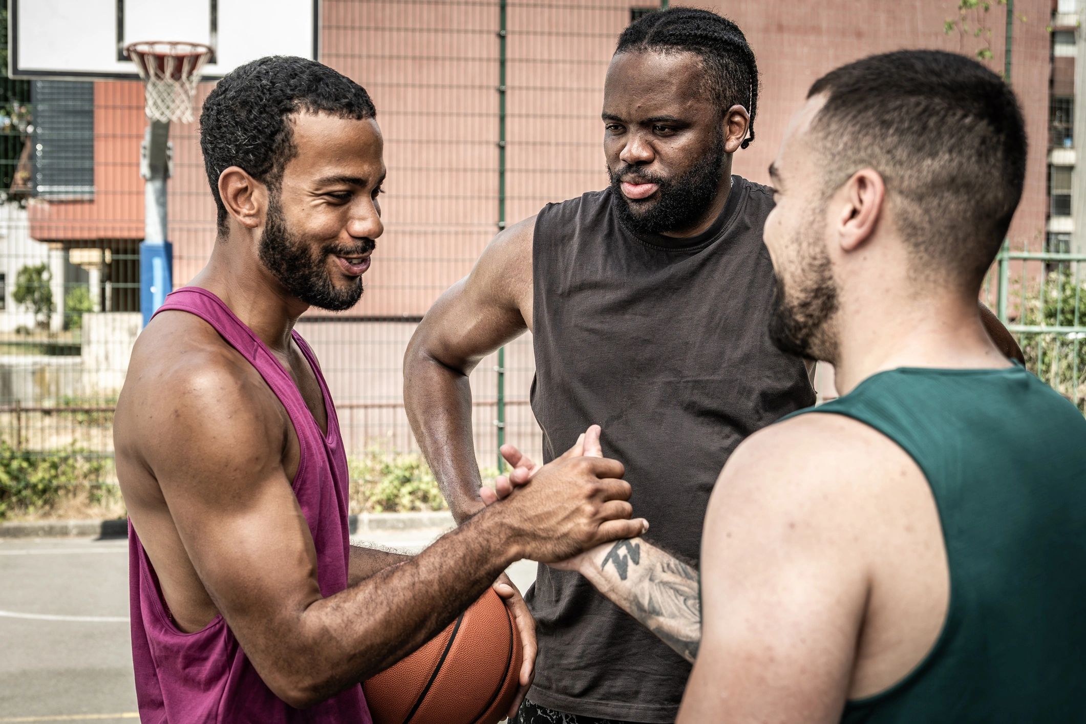 Players gathered on outdoor basketball court