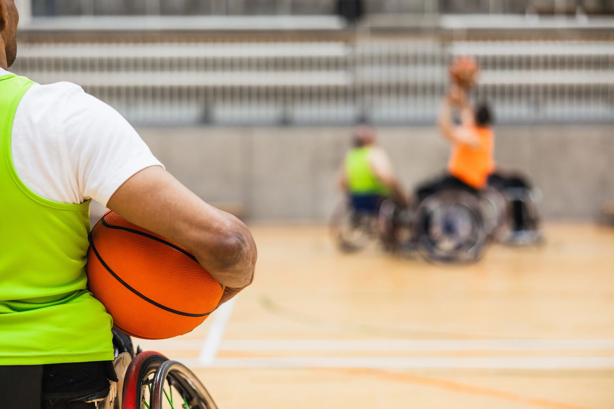 Basketball player holding the ball on court