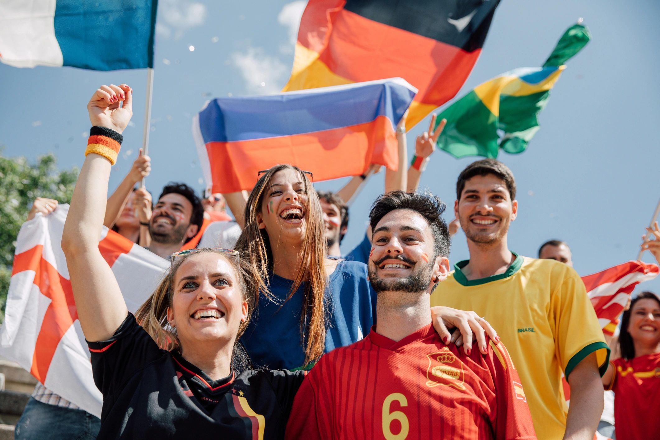 Supporters smiling together at a sports event